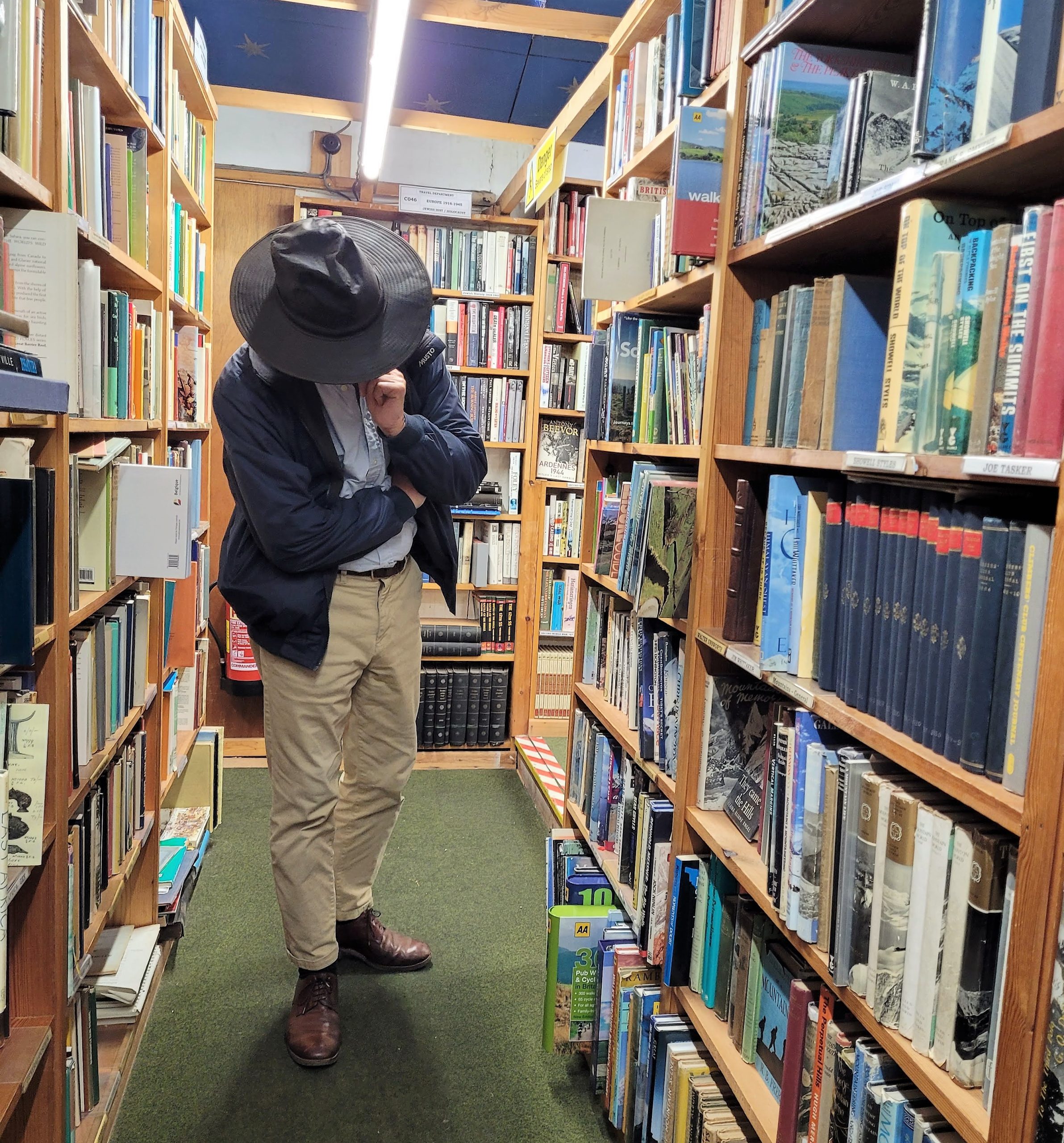Jack looking at a huge bookshelf.